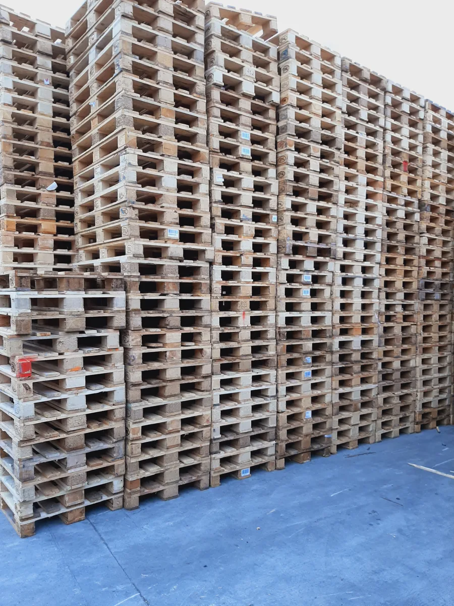 Stacks of used 1200 by 800 mm Euro pallets