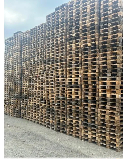 Stacks of weathered wooden Euro pallets