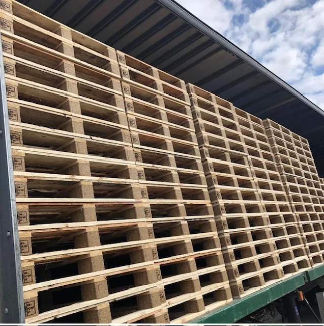 Wooden pallet stacks loaded on a delivery trailer
